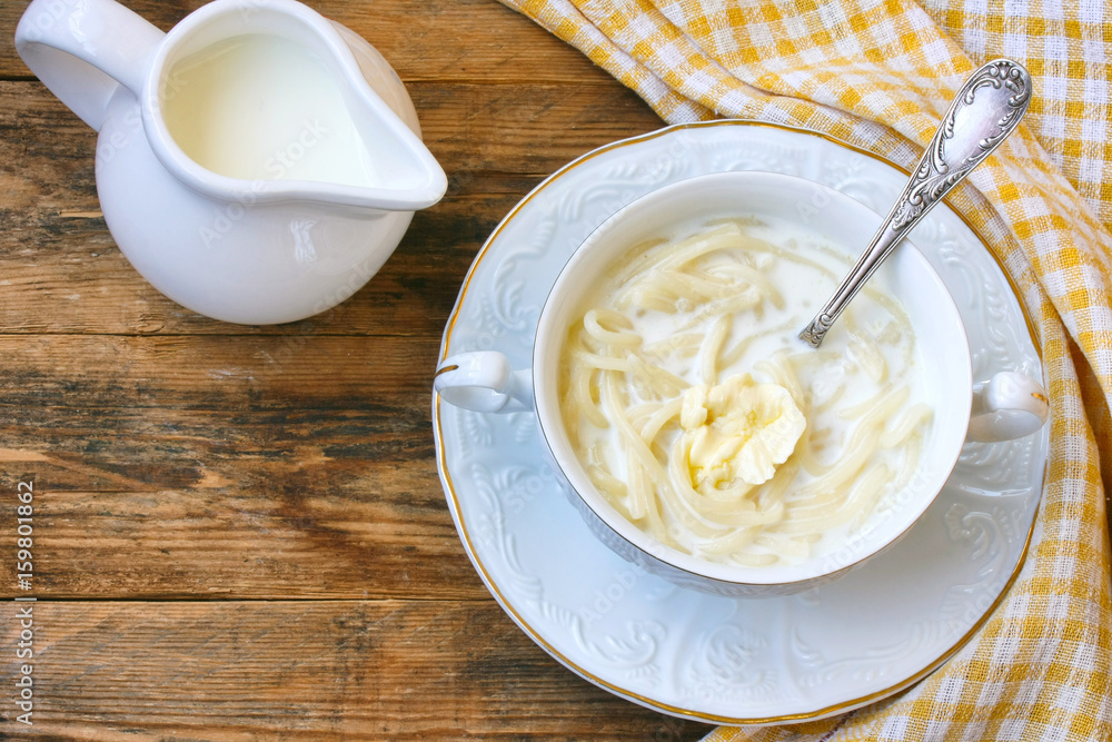 sweet dairy noodles in a white bowl on plate
