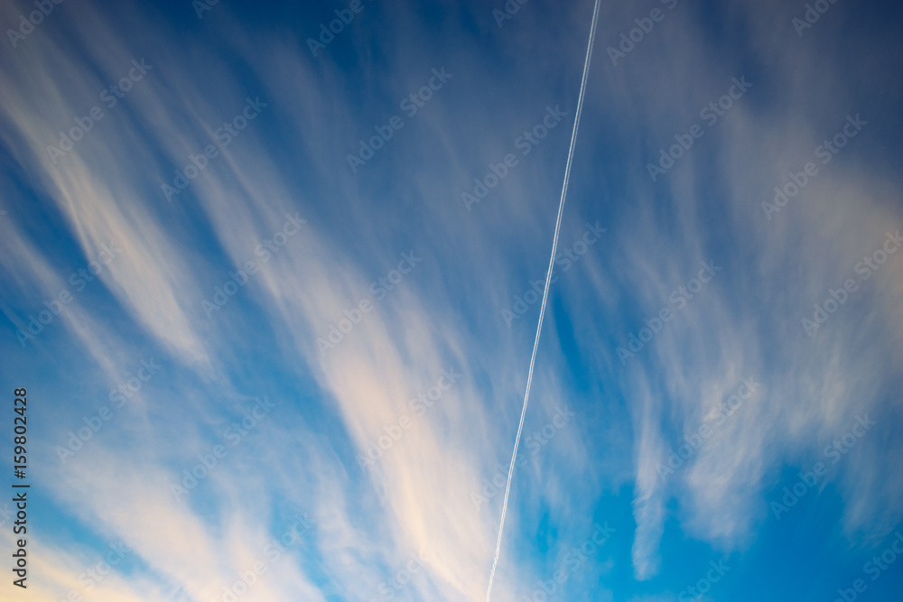 Trace of aircraft in morning sky with clouds Trace of aircraft in morning sky with clouds
