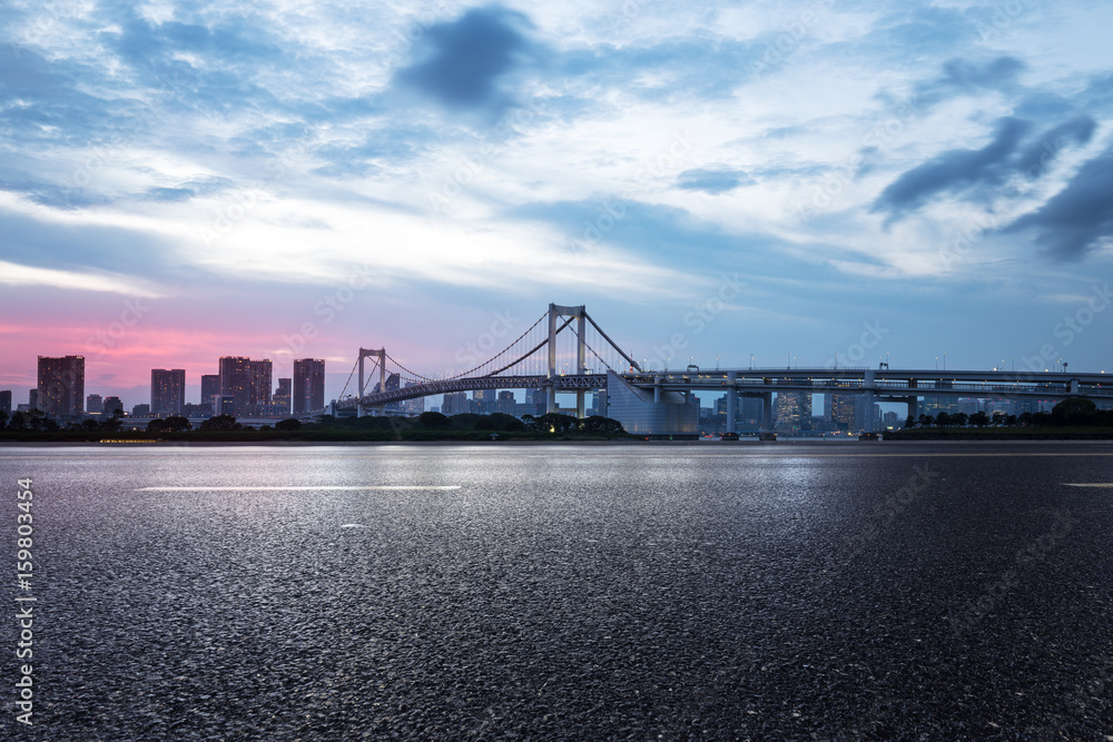 empty road with suspension bridge in modern city empty road with suspension bridge in modern city