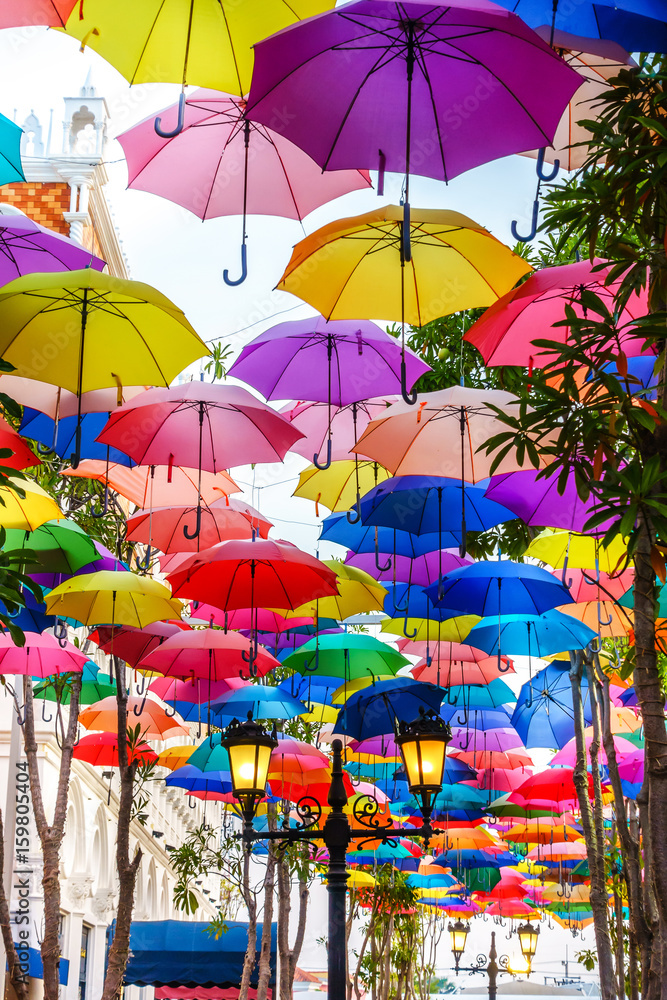 Hua Hin , Thailand - April 26, 2017: Colorful umbrellas art installation at amusement park in Hua Hin, Thailand. Street decoration. Hua Hin , Thailand - April 26, 2017: Colorful umbrellas art installation at amusement park in Hua Hin, Thailand. Street decoration.