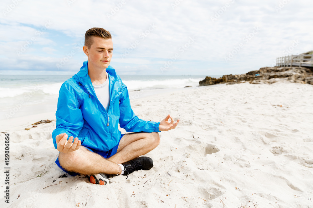 Man training on beach outside Man training on beach outside
