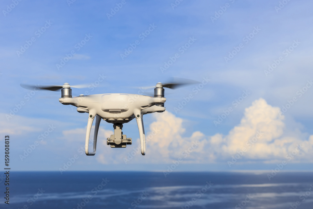 New drone flying over the sea on blue sky while taking landscape photos New drone flying over the sea on blue sky while taking landscape photos