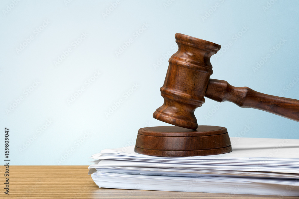judge hammer on white paper and table judge hammer on white paper and table