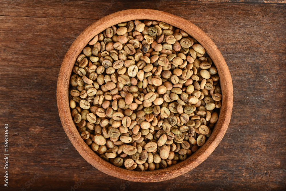 Freshly coffee beans in bowl for background Freshly coffee beans in bowl for background