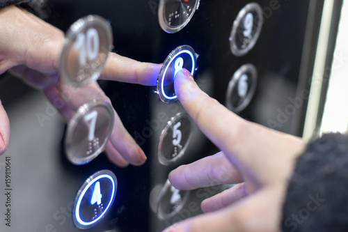 Elevator interior with modern design and pressing elevator buttons