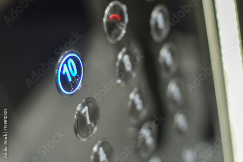 Elevator interior with modern design and pressing elevator buttons