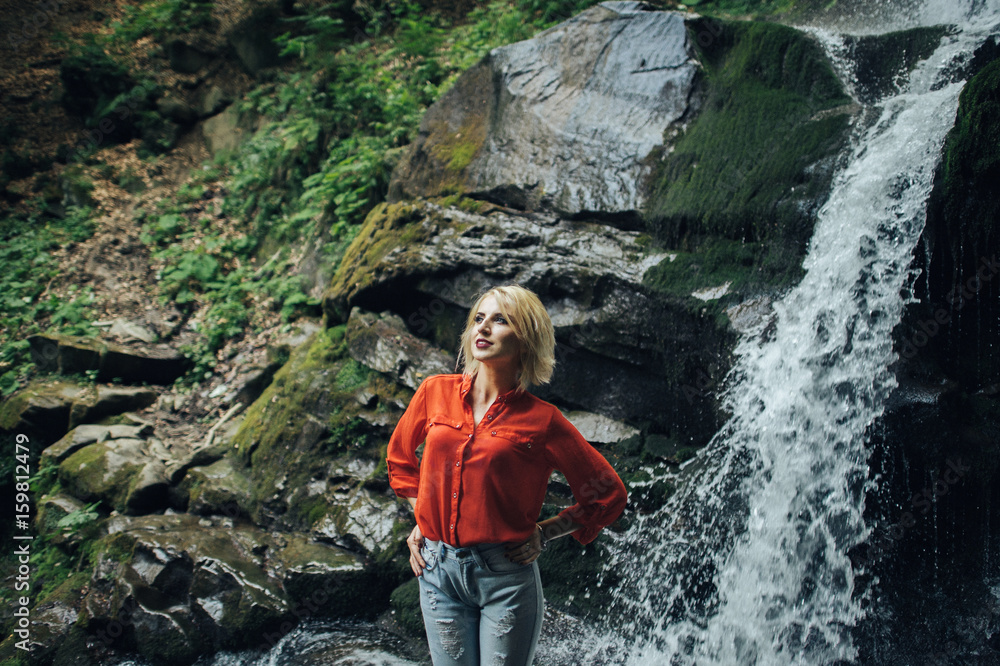 beautiful woman posing near waterfall beautiful woman posing near waterfall