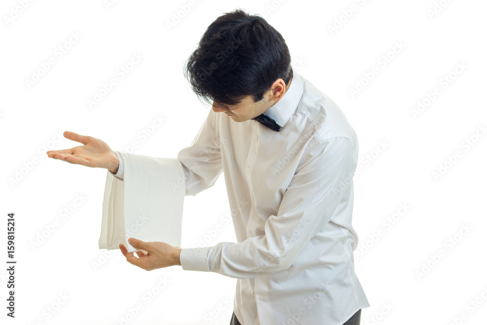 the young waiter puts his hands on a towel isolated on a white background