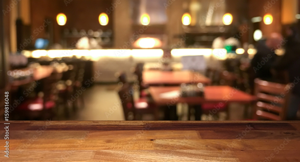 Empty wooden table top with blurred restaurant on background Stock Photo |  Adobe Stock