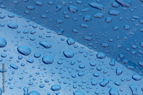 raindrops on blue metalic surface