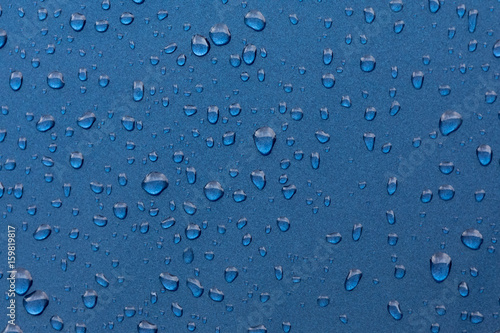 raindrops on blue metalic surface