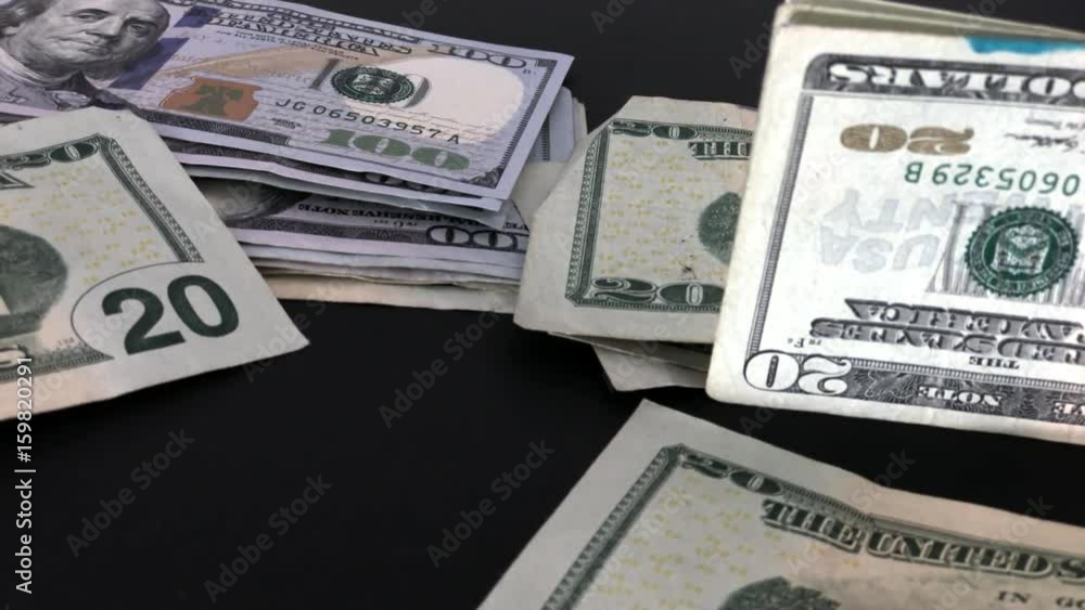 Various Dollar Bills Waving On Table Various Dollar Bills Waving On Table