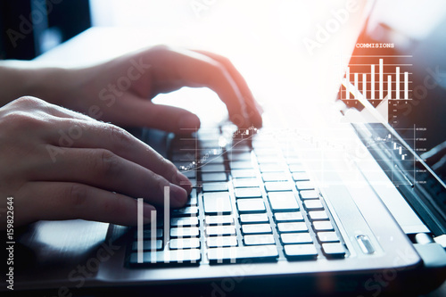 Male hands on a laptop keyboard