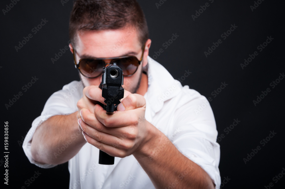 Gangster killer aiming at you with automatic gun Gangster killer aiming at you with automatic gun