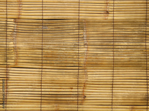 Texture of an old worn bamboo sun shade for various wooden backgrounds