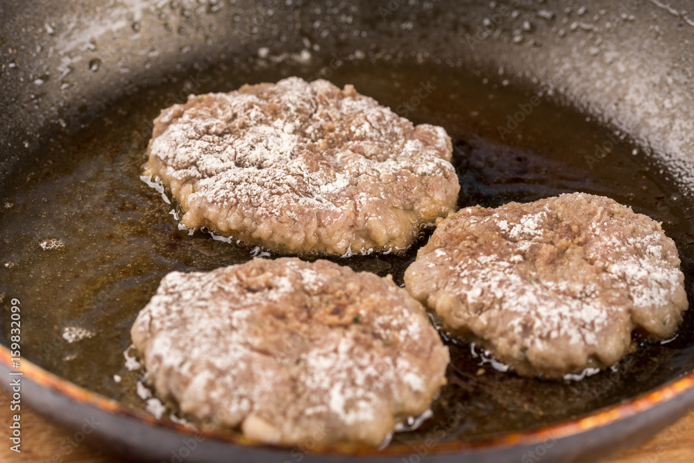 Frying meatballs of minced meat in the frying pan on the oil Frying meatballs of minced meat in the frying pan on the oil