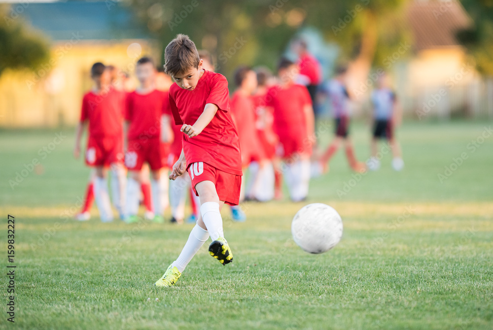 Kids soccer football - children players match on soccer field