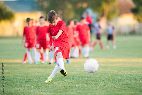 Kids soccer football - children players match on soccer field © Dusan Kostic