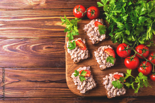 Toast with kosher Forshmak paste, parsley and cherry tomatoes