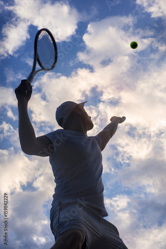 tennis player serving outdoor © Mikael Damkier