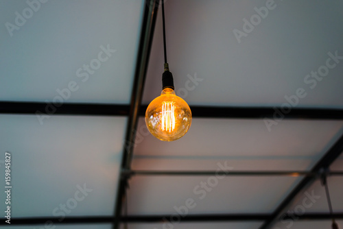 Warm light bulb on ceiling floor
