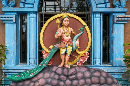 Hindu God Murugan statue with peacock at Sri Aruloli Thirumurugan Temple