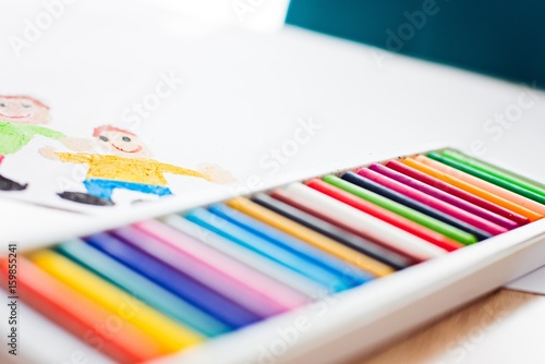 Colorful pastel oil crayons and children's drawing