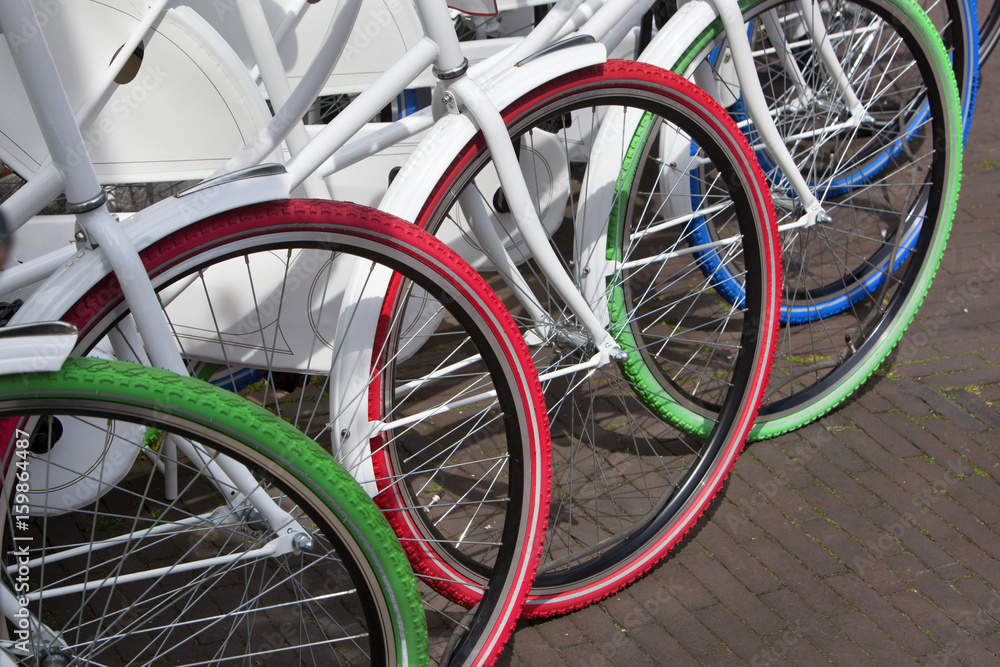 White bicycles with colorful tires White bicycles with colorful tires