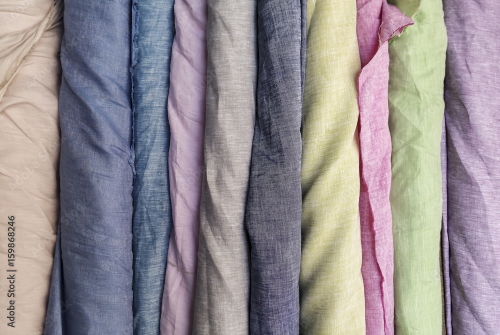 Natural linen fabric in roll background Natural linen fabric in roll background