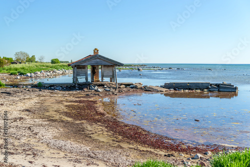 Small and abandoned boathouse and pier. Time and weather has been tough on this place. Ossby in southern Oland, Sweden.