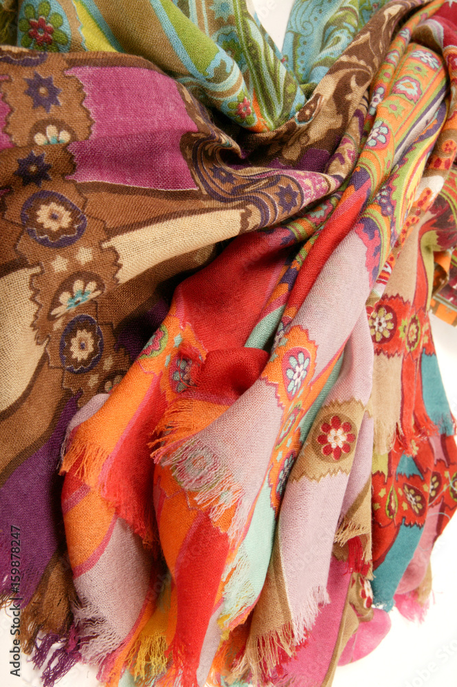 Fototapeta premium Still life of colorful scarves, draped on table, isolated neckerchief, Women Accessories