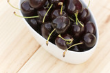 White bolw  with ripe cherries