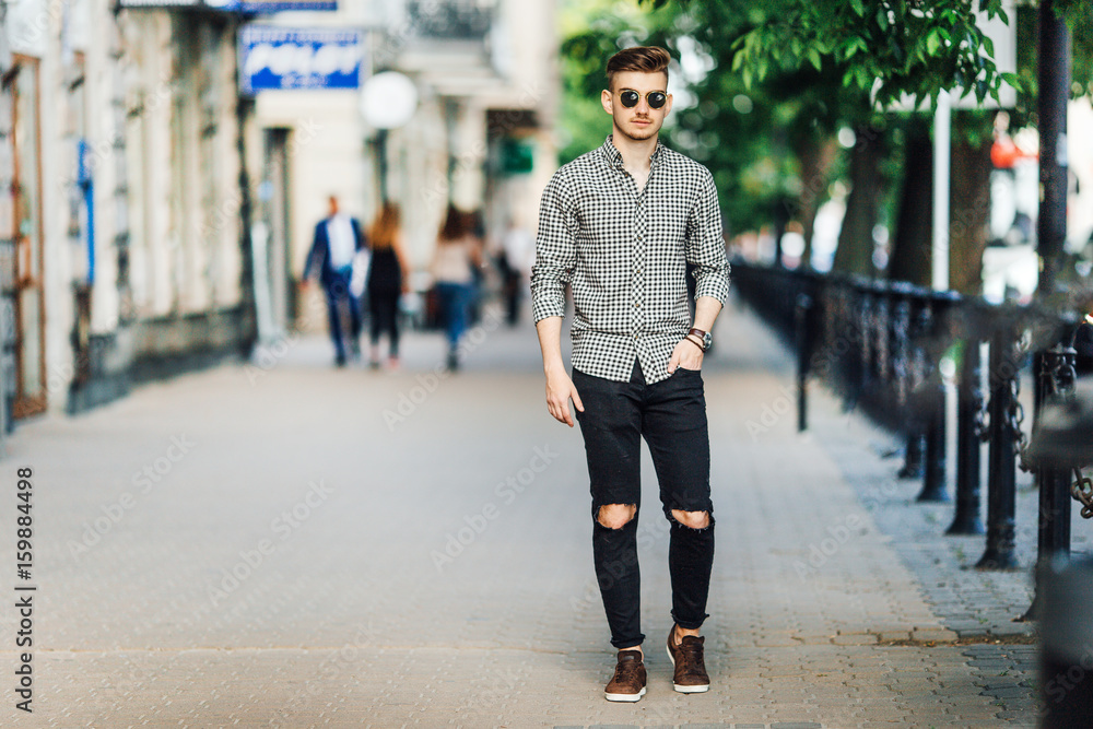 Fashionable man walk outdoors with white background street