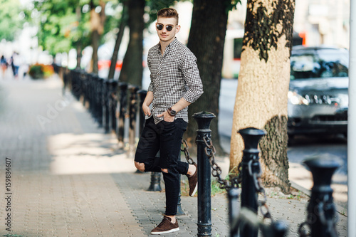 Fashionable man walk outdoors with white background street