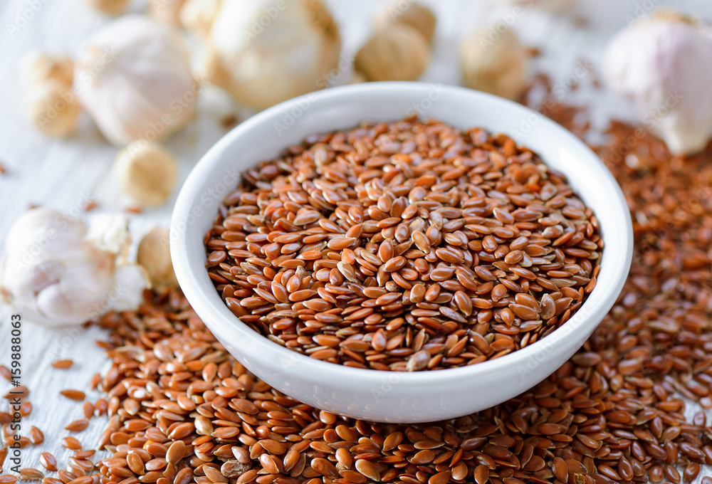 Flax seeds in bowl on table Flax seeds in bowl on table