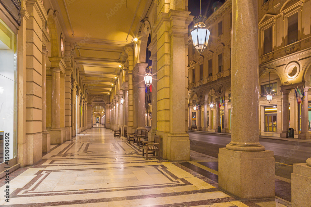 Turin - The porticoes of of Via roma street at dusk.