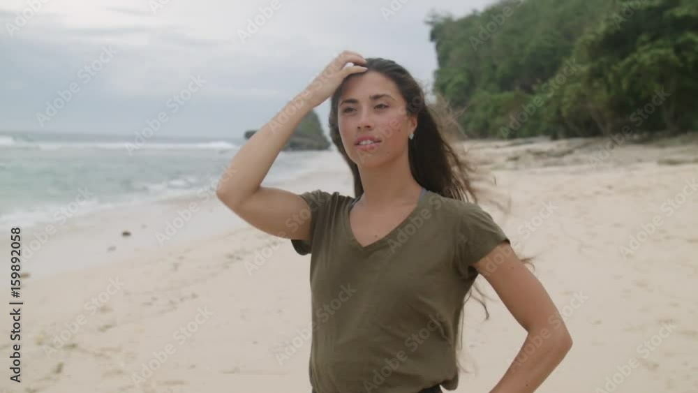 Happy girl with long hair posing on beach Happy girl with long hair posing on beach