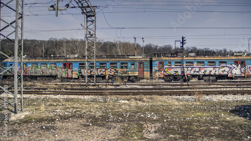 Passenger train covered with graffiti