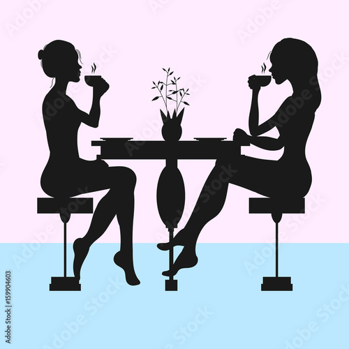 Silhouettes of two women drinking tea or coffee 