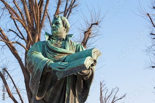 Berlin - The staue of reformator Martin Luther in front of Marienkirche church by Paul Martin Otto and Robert Toberenth (1895). photo