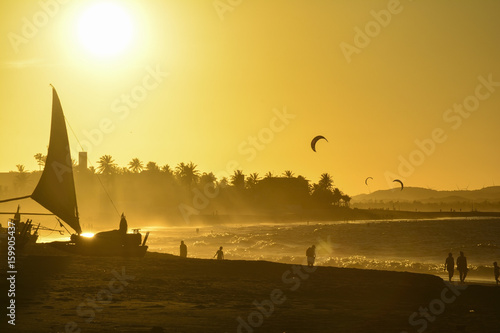 Sunset at Cumbuco Beach. Kite surfers on the sea, Ceara State, Brazil