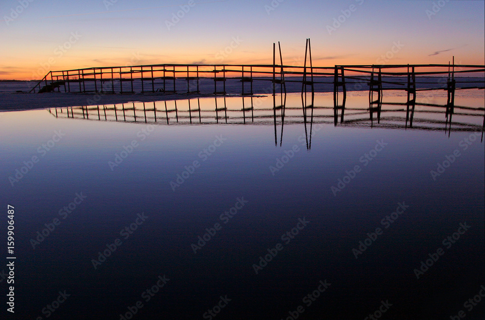 Fototapeta premium Wooden pedestrian bridge over the river