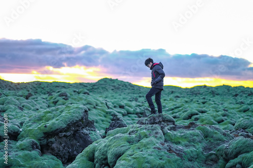 A man walk in the Moss lava field in Iceland