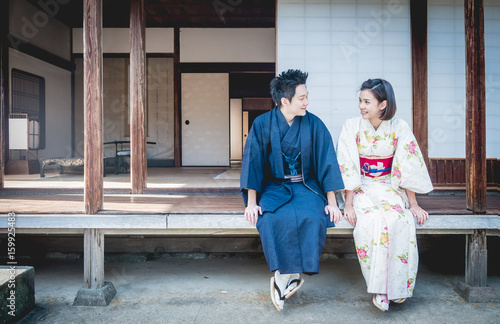 Asian man talking to a woman at the backyard