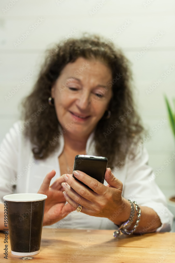 Smiling woman using cellplhone Smiling woman using cellplhone