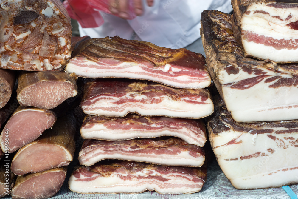 Raw bacon for sale on market