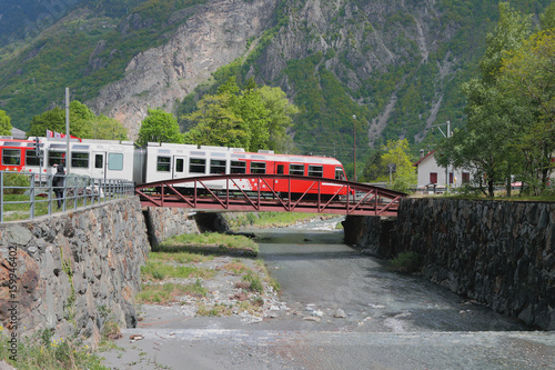 Train, bridge and river Trient. Vernayaz, Martigny, Switzerland photo