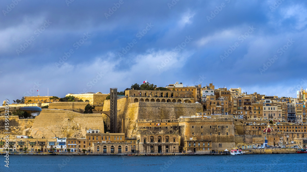 Valletta, Malta - Panoramic skyline view of Valletta with Grand Harbor and blue sky with clouds