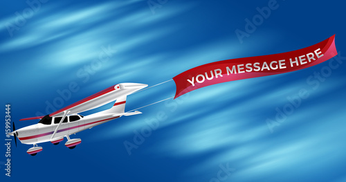Small Single Engine White Propeller Airplane Dragging An Advertising Banner