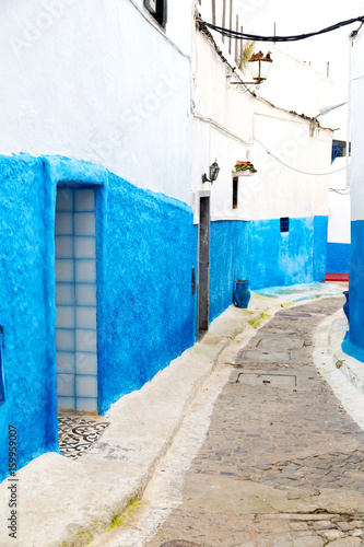 old door in morocco africa ancien and wall ornate   blue street © lkpro